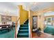 Entry foyer with stairway, chandelier in adjacent dining room, and view to living area at 101 Canopy Ct, Mooresville, NC 28115