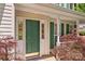 View of front door featuring sidelights, house number and healthy landscaping at 101 Canopy Ct, Mooresville, NC 28115