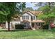 Charming two-story home with a well-maintained lawn and mature trees providing shade at 101 Canopy Ct, Mooresville, NC 28115