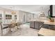 Eat-in kitchen with white countertops, stainless appliances, and pool view at 101 Canopy Ct, Mooresville, NC 28115