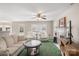 Bright living room with fireplace, neutral furniture, and backyard access at 101 Canopy Ct, Mooresville, NC 28115