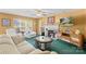 Cozy living room with plush seating, a fireplace, and bright windows at 101 Canopy Ct, Mooresville, NC 28115