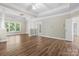 Bedroom with a tray ceiling, wood floors and a connecting bathroom at 10836 Fox Hedge Rd, Matthews, NC 28105