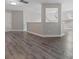 Large bonus room area with natural light, wood-look flooring, neutral walls, and open concept design at 10836 Fox Hedge Rd, Matthews, NC 28105