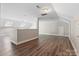 Spacious bonus room with neutral walls, wood-look flooring, skylights, and ample natural light at 10836 Fox Hedge Rd, Matthews, NC 28105