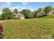 Expansive lawn showcasing a charming brick home at 10836 Fox Hedge Rd, Matthews, NC 28105