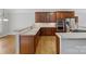 Open kitchen with wood cabinets, stainless steel appliances, tile backsplash and sink at 10836 Fox Hedge Rd, Matthews, NC 28105