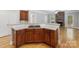Kitchen island with gas cooktop and bar seating, perfect for entertaining guests at 10836 Fox Hedge Rd, Matthews, NC 28105