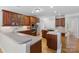 Well-equipped kitchen with stainless steel appliances, ample wood cabinetry and island at 10836 Fox Hedge Rd, Matthews, NC 28105