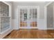 Elegant room showcasing hardwood floors and French doors at 10836 Fox Hedge Rd, Matthews, NC 28105