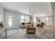 Inviting living room featuring an abundance of natural light, ceiling fan, and a dining area at 1090 Bowser St, Rock Hill, SC 29730