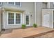 Nice backyard deck space with an exterior door, windows, and attractive plants at 10943 Winterbourne Ct, Charlotte, NC 28277