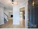 Inviting foyer showcasing tiled floors leading to the living room and kitchen area at 10943 Winterbourne Ct, Charlotte, NC 28277