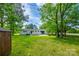 Expansive backyard showing house exterior, trees, and lush green grass at 1090 Bowser St, Rock Hill, SC 29730