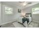 This spacious room features a fan, two large windows and a decorative carpet at 1090 Bowser St, Rock Hill, SC 29730