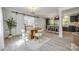 Cozy dining area with stylish chairs and modern sliding barn door to living space at 1090 Bowser St, Rock Hill, SC 29730