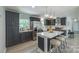 Modern kitchen featuring dark cabinets, stainless steel appliances, and a center island at 1090 Bowser St, Rock Hill, SC 29730