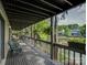 Spacious back porch with tranquil lake views, relaxing spot to enjoy the sunset at 1114 Palmyra Dr, Tega Cay, SC 29708