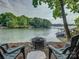 Lakeside backyard with room for fun, fire pit and beautiful trees at 1114 Palmyra Dr, Tega Cay, SC 29708
