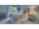 Bedroom with a full-sized bed, desk, and window view that opens to a private deck at 1114 Palmyra Dr, Tega Cay, SC 29708