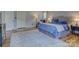 Spacious main bedroom with a large bed, and hardwood floors throughout at 1114 Palmyra Dr, Tega Cay, SC 29708