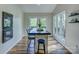 Eat-in kitchen area featuring bright light, long bar-style table, and backyard views at 1114 Palmyra Dr, Tega Cay, SC 29708