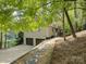 Home with an attached garage, beautiful landscaping, and lake views at 1114 Palmyra Dr, Tega Cay, SC 29708