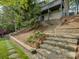 Multi-story home on the lake with landscaped hillside at 1114 Palmyra Dr, Tega Cay, SC 29708