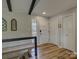 Home foyer with wood floors, a staircase, and plenty of closet space at 1114 Palmyra Dr, Tega Cay, SC 29708