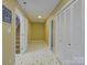 Hallway with 'Go jump in the lake' sign and storage closet in the basement at 1114 Palmyra Dr, Tega Cay, SC 29708
