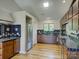 Well-lit kitchen with stainless steel refrigerator and complementary dark blue tile backsplash at 1114 Palmyra Dr, Tega Cay, SC 29708