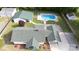 A high aerial view of the home, pool, and detached garage from the back yard at 1115 Old Thompson Ave, Lancaster, SC 29720