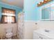 Bright bathroom with light blue walls and a white vanity at 1115 Old Thompson Ave, Lancaster, SC 29720