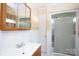 Bathroom with a vanity sink and a tiled shower with glass doors at 1115 Old Thompson Ave, Lancaster, SC 29720