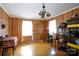 Wood-paneled bonus room with hardwood floors, natural light, and shelving for storage at 1115 Old Thompson Ave, Lancaster, SC 29720