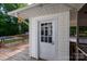 View of the exterior white door leading to the pool and backyard at 1115 Old Thompson Ave, Lancaster, SC 29720