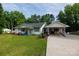 Charming one-story home with well-maintained lawn, carport, and front porch at 1115 Old Thompson Ave, Lancaster, SC 29720