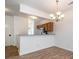 Open dining area featuring a modern chandelier and a view into the kitchen at 11229 Lions Mane St, Charlotte, NC 28273