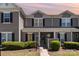 Charming two-story townhome with black shutters and inviting front yard landscaping at 11229 Lions Mane St, Charlotte, NC 28273