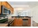 Well-equipped kitchen featuring stainless steel appliances and an open layout to the living areas at 11229 Lions Mane St, Charlotte, NC 28273