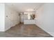 Open-concept living area with wood floors flowing into the dining and kitchen space at 11229 Lions Mane St, Charlotte, NC 28273