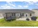 Spacious backyard with patio, trampoline, seating, and well-maintained lawn at 1125 Silvertrace Dr, Salisbury, NC 28144