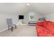 Cozy bedroom featuring a sloped ceiling, natural light, and comfortable furnishings at 1125 Silvertrace Dr, Salisbury, NC 28144