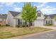 Charming home featuring a 2-car garage, landscaped yard, and inviting front entrance at 1125 Silvertrace Dr, Salisbury, NC 28144