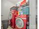 Convenient laundry area equipped with modern red washer and dryer at 1125 Silvertrace Dr, Salisbury, NC 28144
