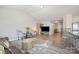 Bright living room featuring a modern open floorplan with wood-look floors at 1125 Silvertrace Dr, Salisbury, NC 28144