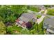 Aerial view of home showcasing patio with pergola, lush landscaping, and expansive backyard at 11424 Brangus Ln, Mint Hill, NC 28227