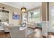 Cozy living room with hardwood floors, built-in bookshelves, and natural light at 11424 Brangus Ln, Mint Hill, NC 28227