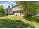Backyard featuring a grassy lawn and siding at 12016 Gemstone Ct, Charlotte, NC 28269