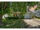 Charming two-story home with a welcoming front porch and well-maintained landscaping offers great curb appeal at 12016 Gemstone Ct, Charlotte, NC 28269